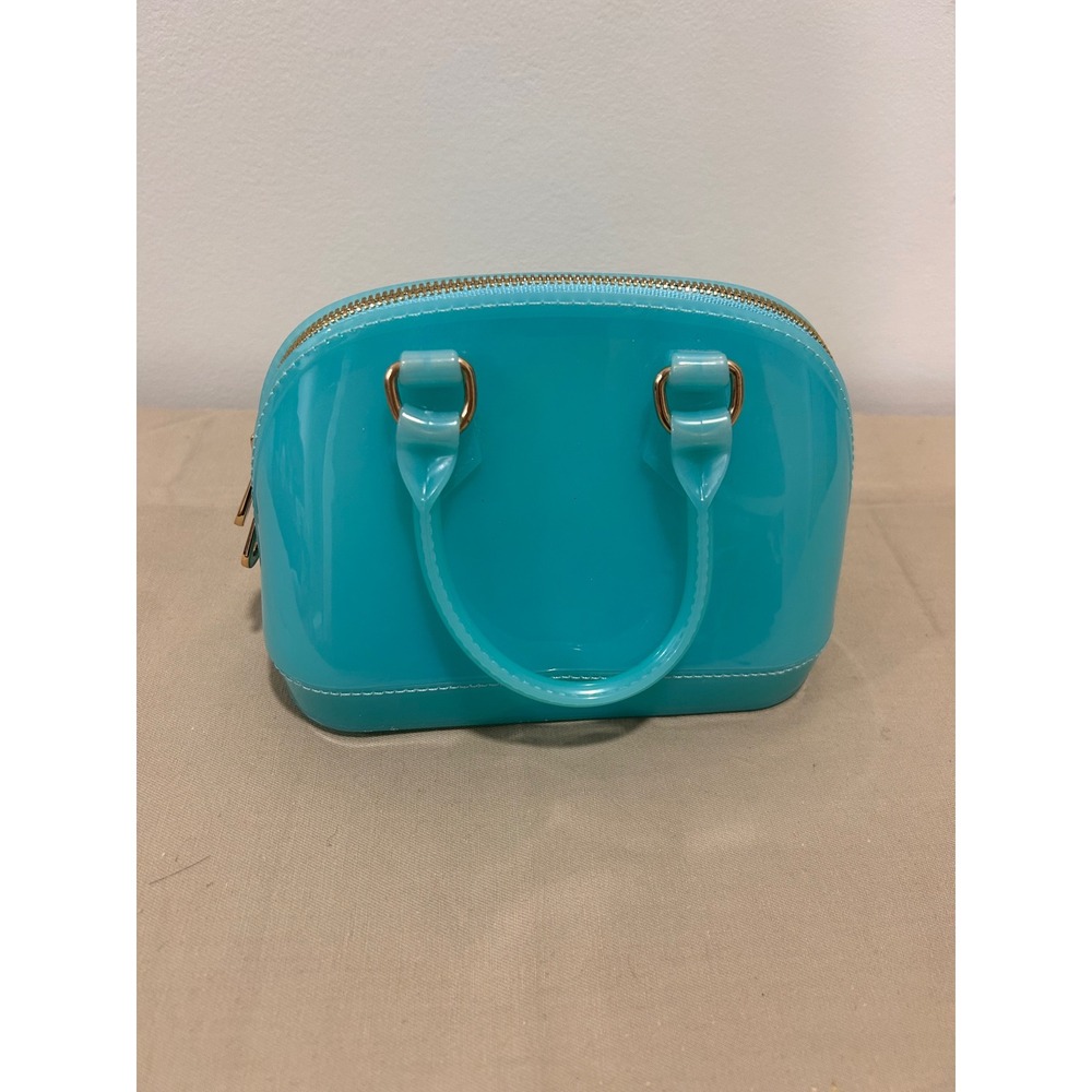Turquoise handbag is likely a jelly-style mii purse - Picture 2 of 4